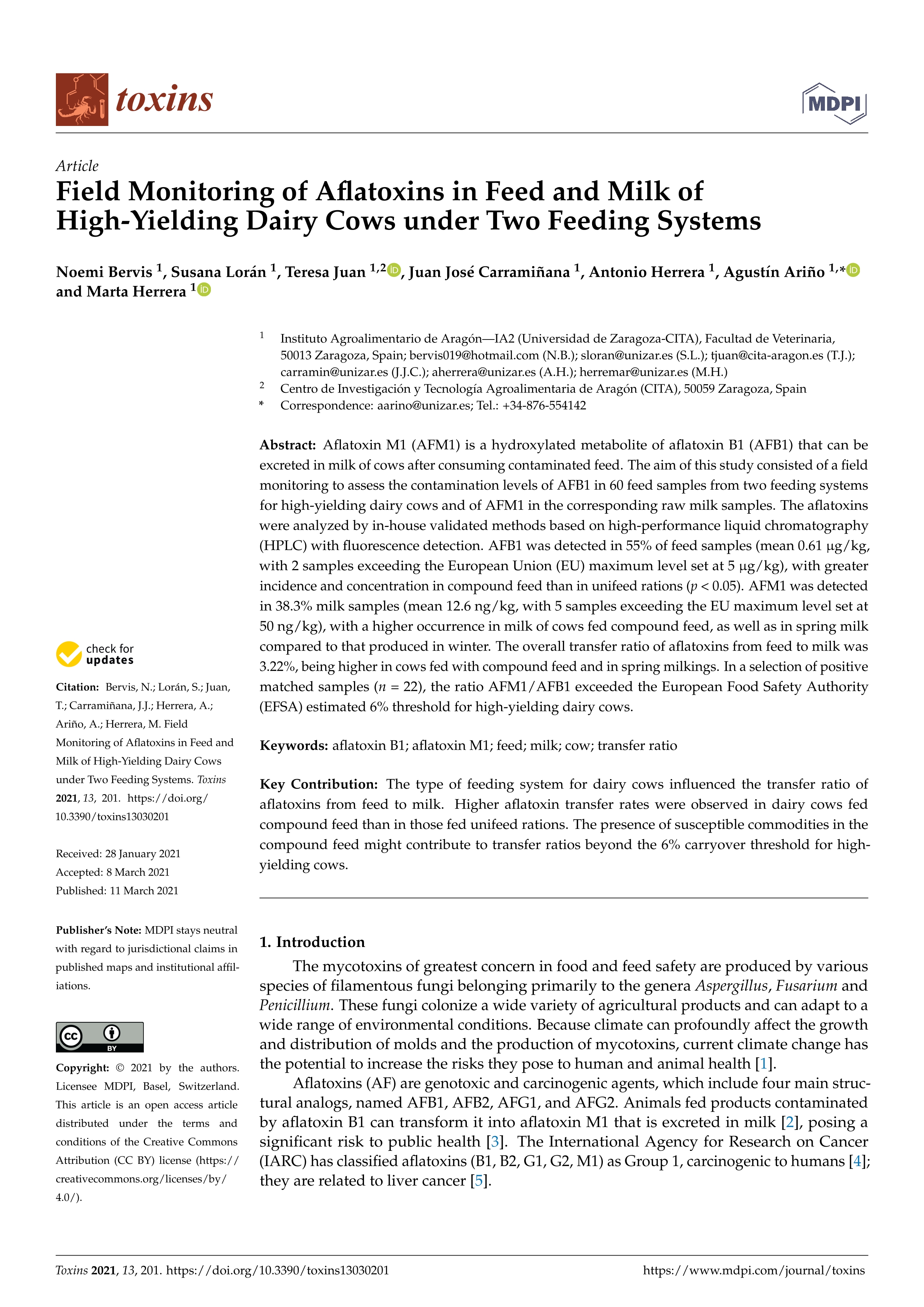 Field monitoring of aflatoxins in feed and milk of high-yielding dairy cows under two feeding systems