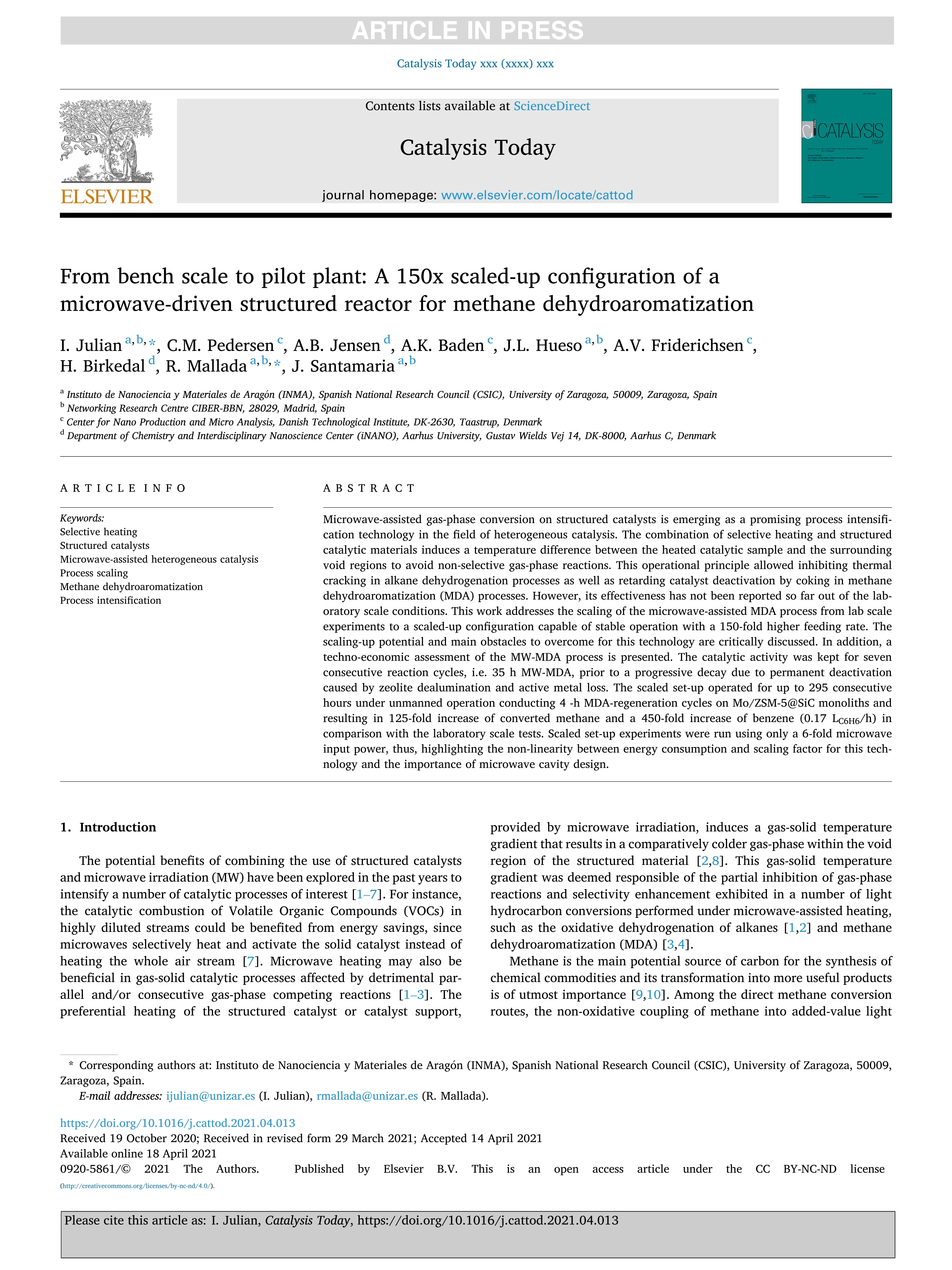 From bench scale to pilot plant: A 150x scaled-up configuration of a microwave-driven structured reactor for methane dehydroaromatization