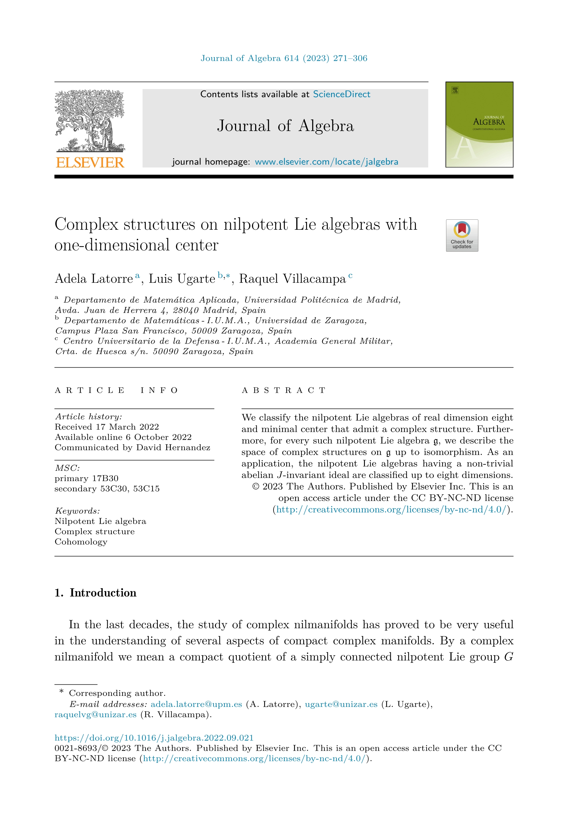 Complex structures on nilpotent Lie algebras with one-dimensional center