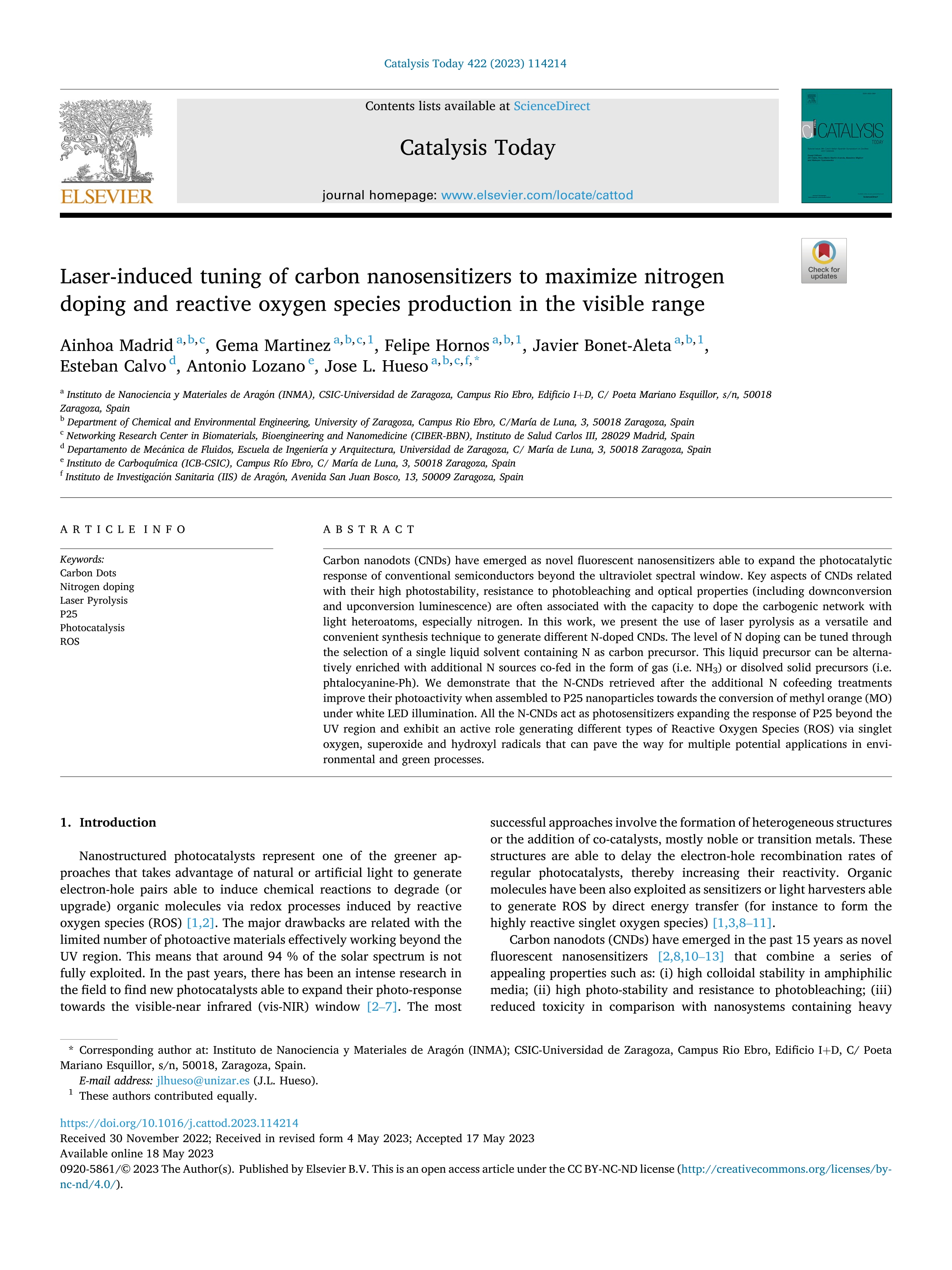 Laser-induced tuning of carbon nanosensitizers to maximize nitrogen doping and reactive oxygen species production in the visible range