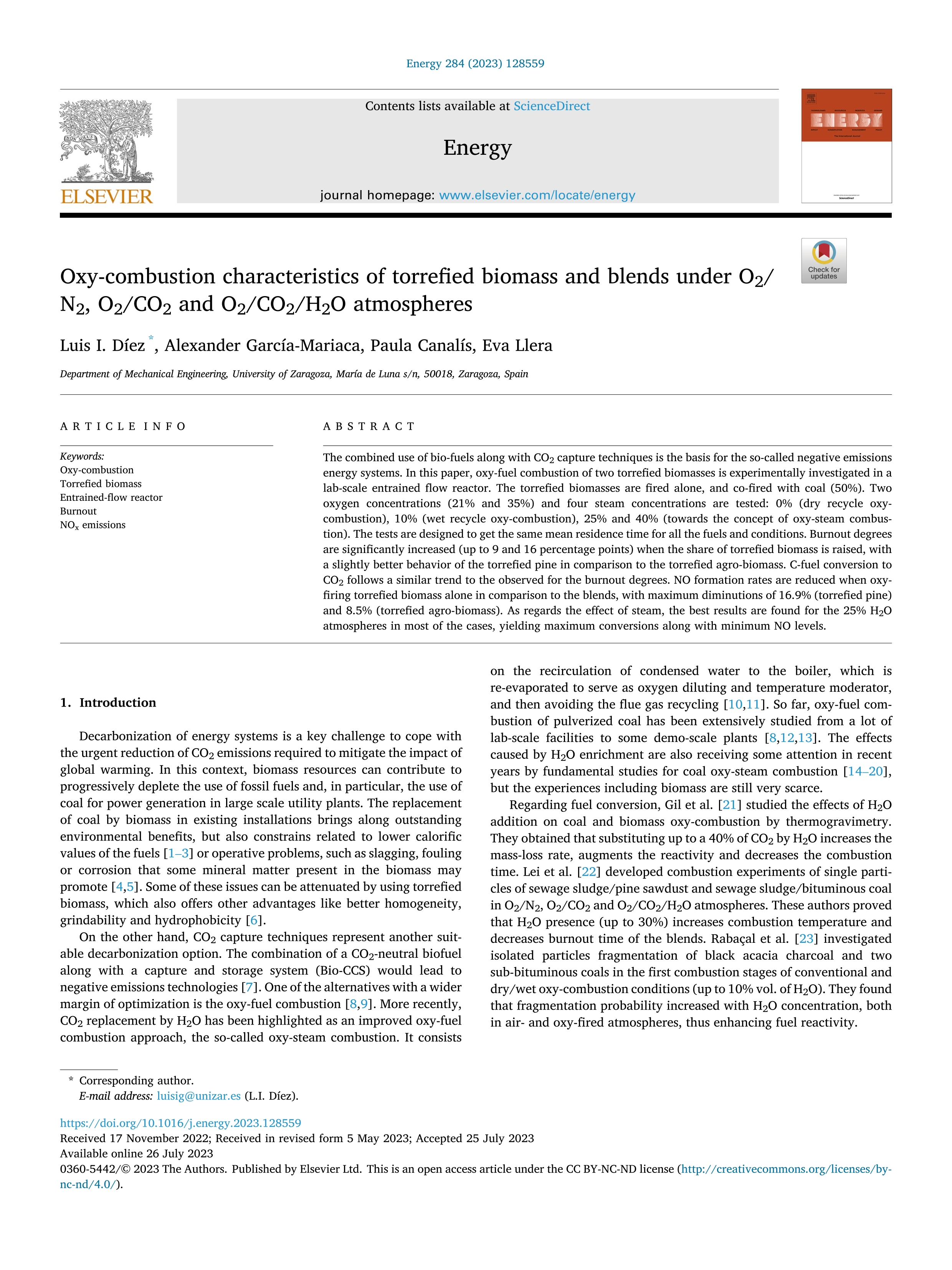 Oxy-combustion characteristics of torrefied biomass and blends under O2/N2, O2/CO2 and O2/CO2/H2O atmospheres