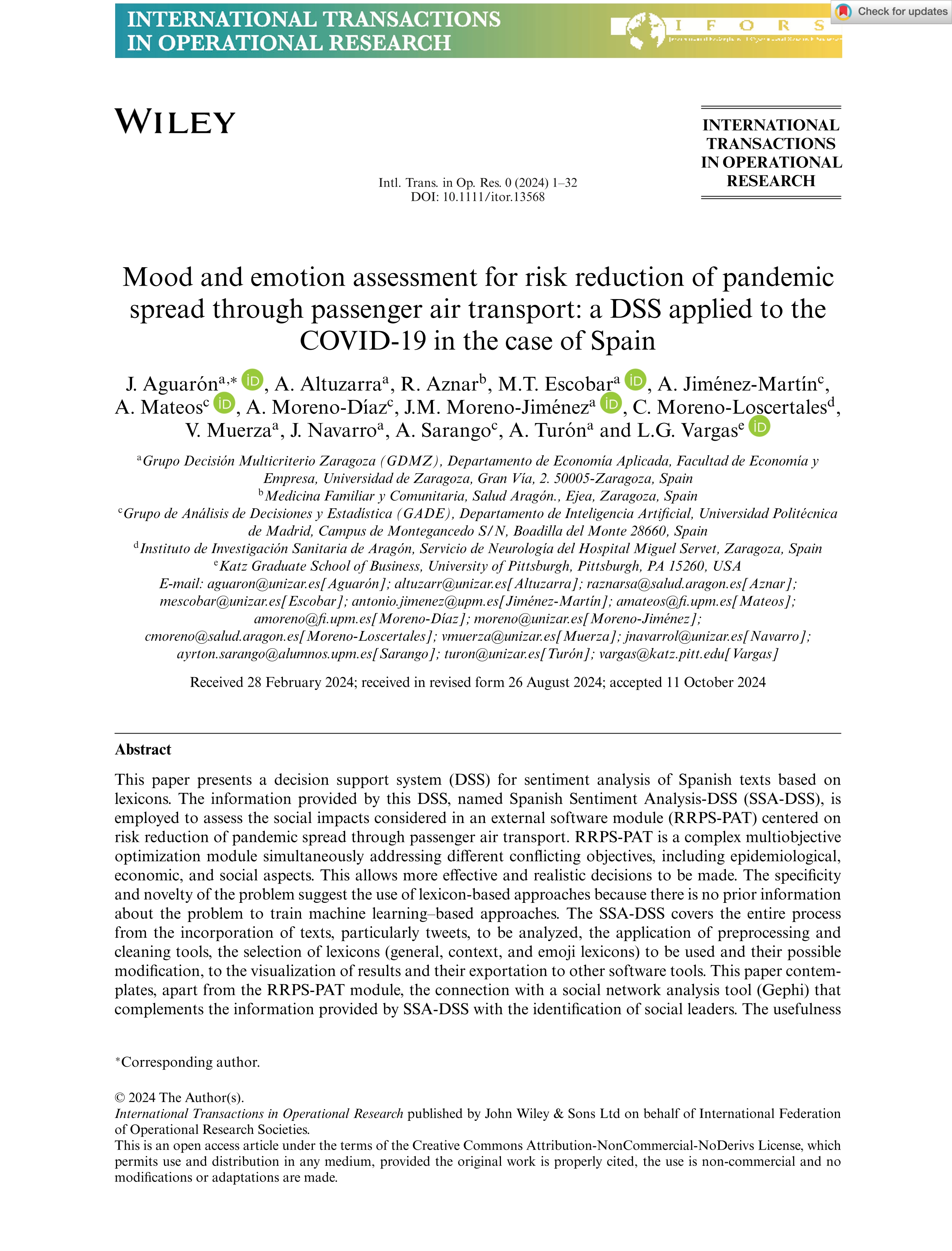 Mood and emotion assessment for risk reduction of pandemic spread through passenger air transport: a DSS applied to the COVID-19 in the case of Spain