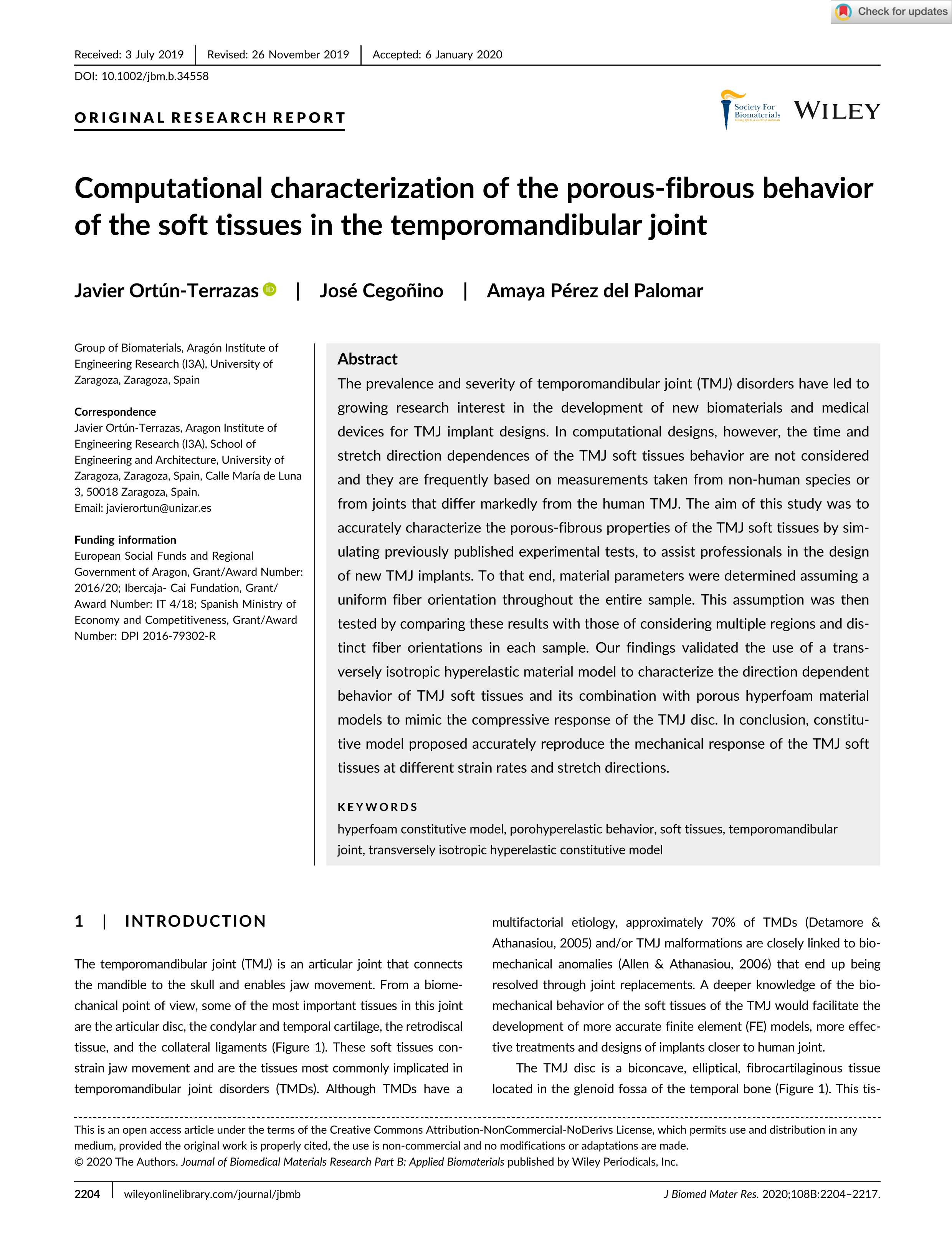 Computational characterization of the porous-fibrous behavior of the soft tissues in the temporomandibular joint