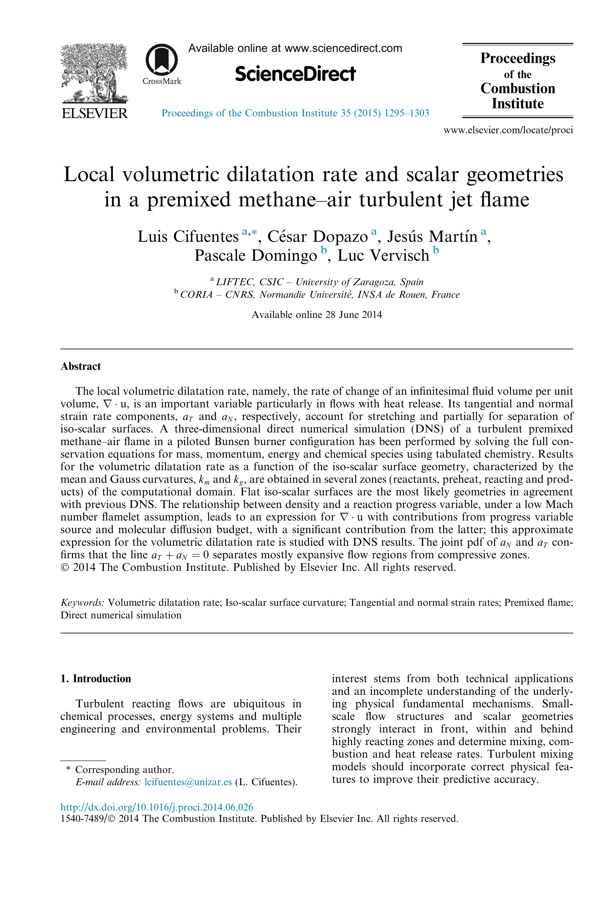Local volumetric dilatation rate and scalar geometries in a premixed methane-air turbulent jet flame