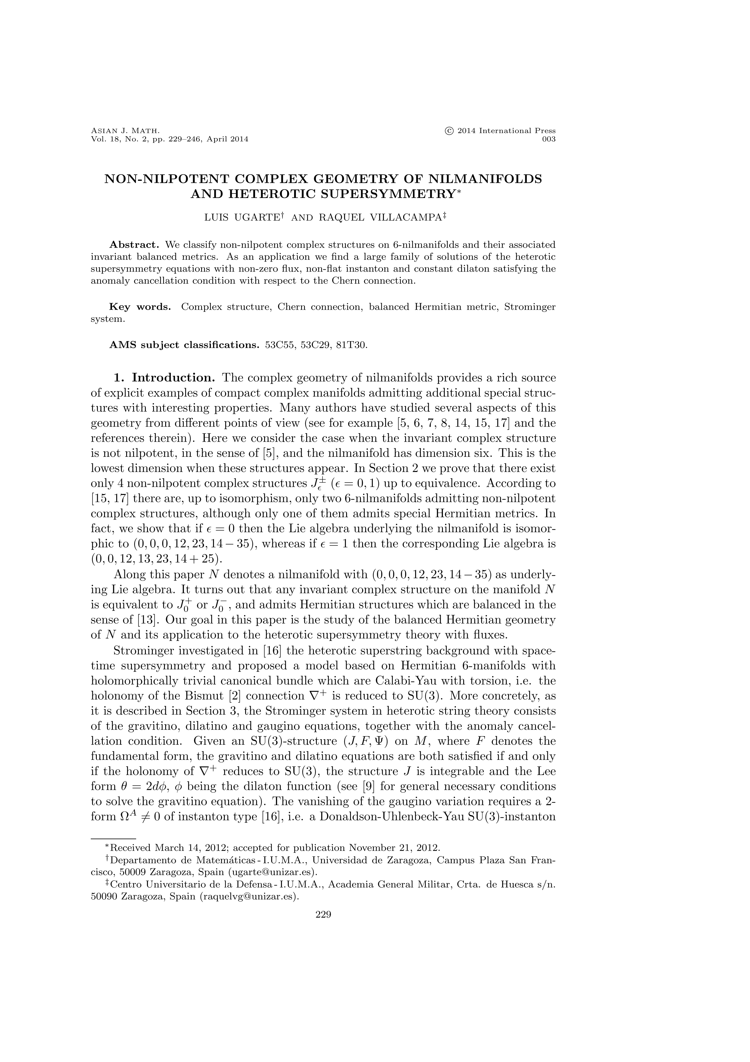 Non-nilpotent complex geometry of nilmanifolds and heterotic supersymmetry