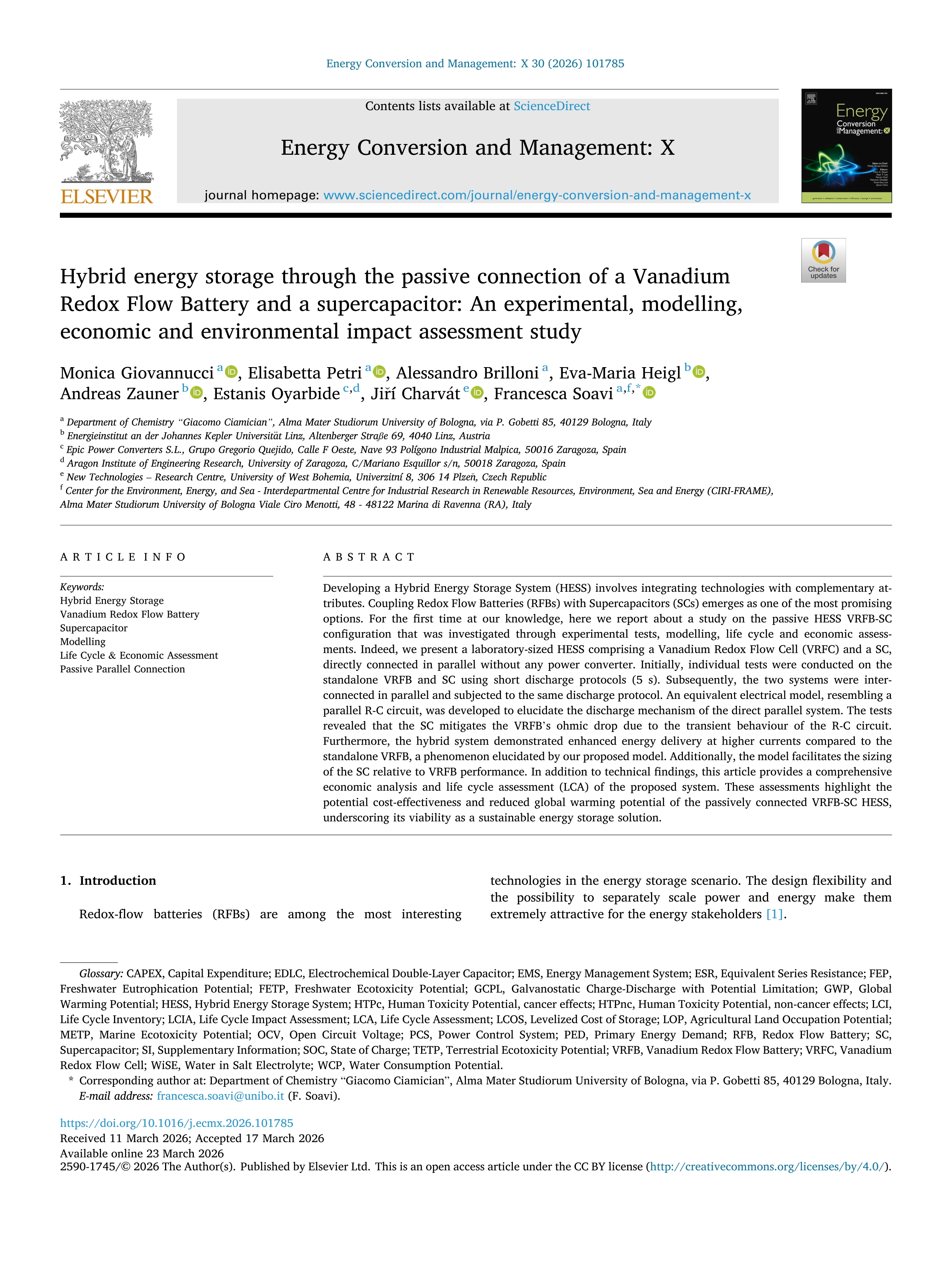 Hybrid energy storage through the passive connection of a Vanadium Redox Flow Battery and a supercapacitor: An experimental, modelling, economic and environmental impact assessment study