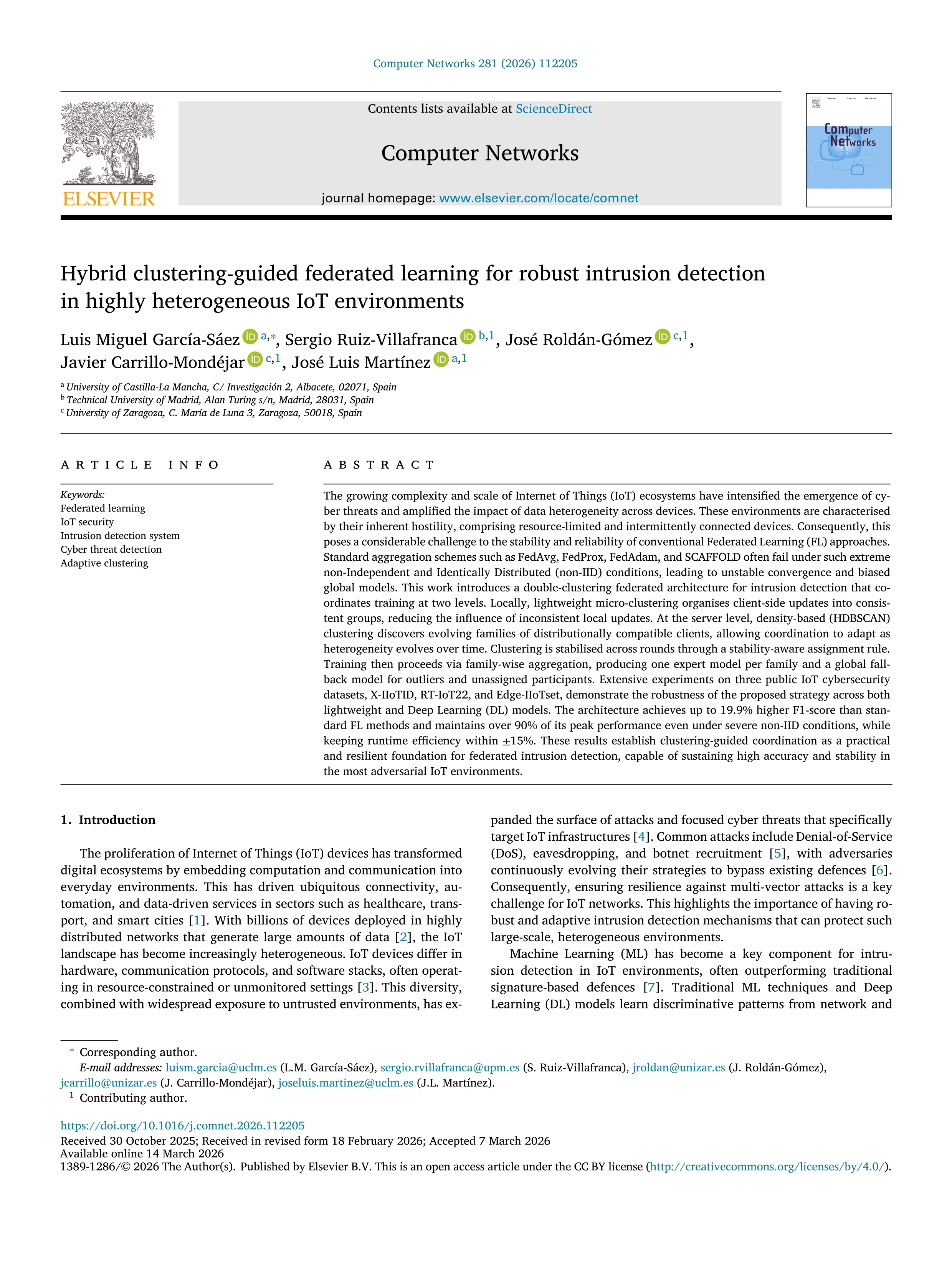 Hybrid clustering-guided federated learning for robust intrusion detection in highly heterogeneous IoT environments